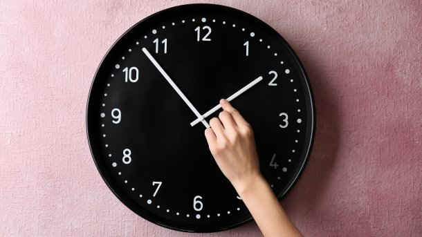 Woman turns clock hand