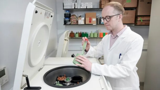 Professor Stephen Wallace of the University of Edinburgh extracts genetically modified bacteria.
