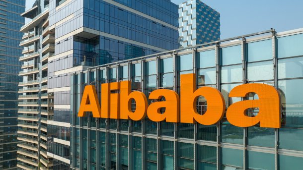 Alibaba logo on the glass facade of a high-rise building