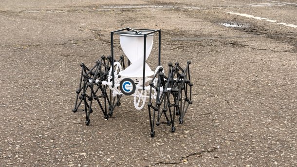 The robot Wander-bot runs on the beach, powered by the wind.