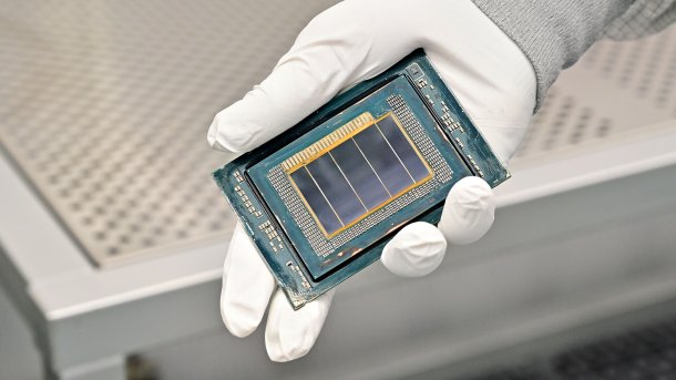 Hand holding a bare processor