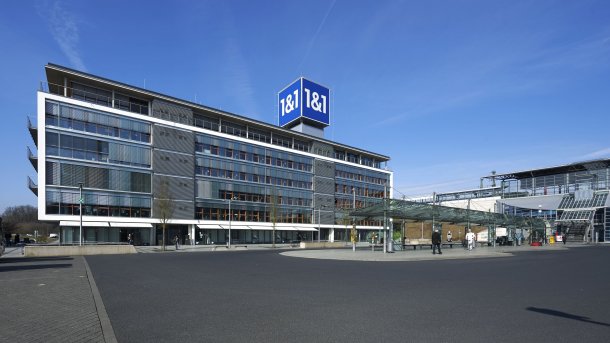 Office building, with a blue cube on top bearing the inscription "1&1"