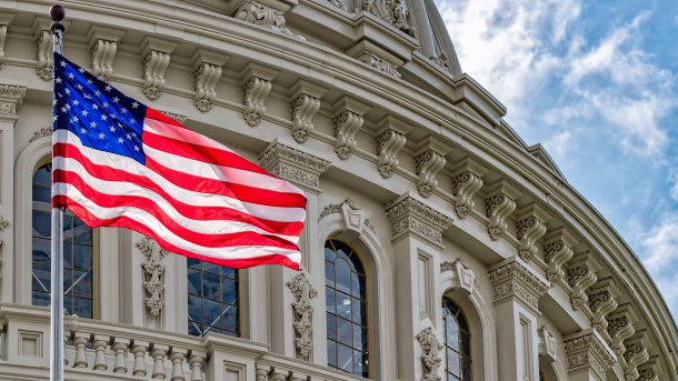 US flag in front of the Capitol in Washington.