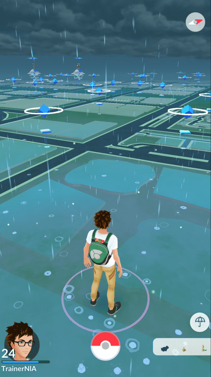 Pokémon-Trainer bei Regen