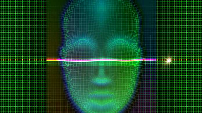 Ein Laser tastet ein grünes Gesicht ab