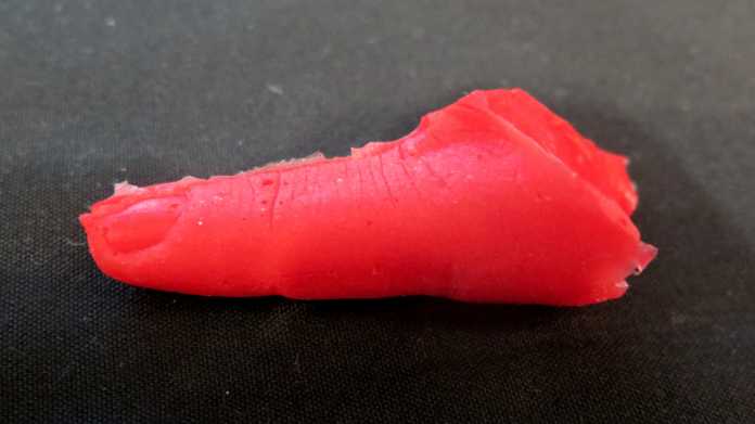 Red finger clone made of silicone
