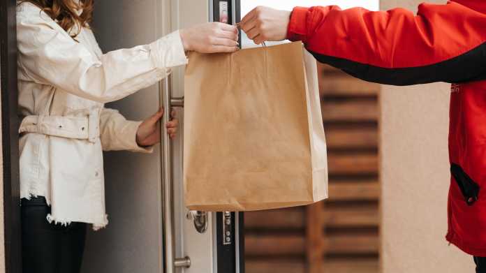 The,Food,Delivery,Man,Passes,The,Craft,Package,To,The