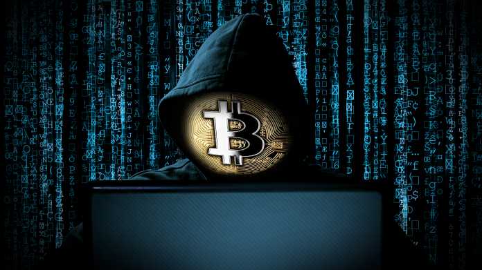 Hacker,With,Bitcoin,Face,Mask,Behind,Notebook,Laptop,In,Front,Crypto,Kryptowährung