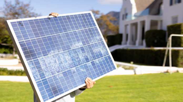 Image,Of,Caucasian,Man,With,Solar,Panel,In,Garden.,Green