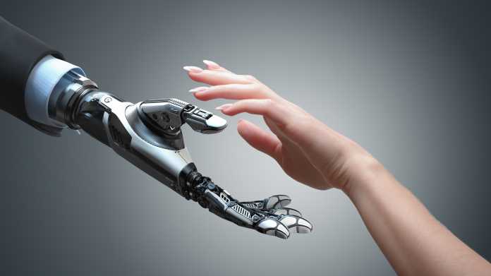 Robot,Gives,A,Hand,To,A,Woman.,Two,Hands,In