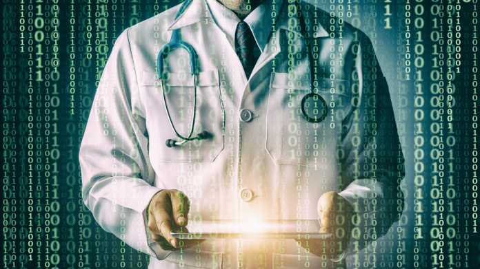 Doctor,With,Stethoscope,And,Tablet,Computer,On,Black,Background,,Still