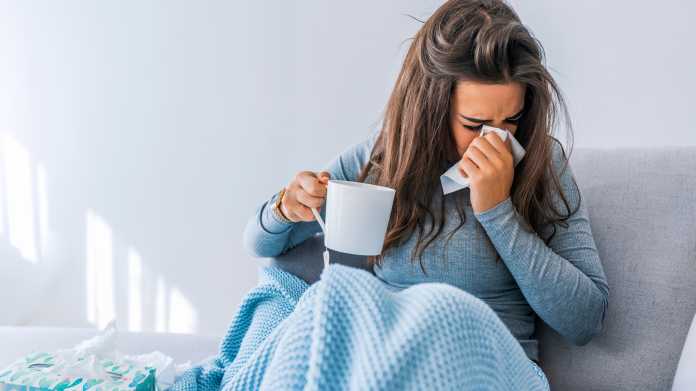 Sick,Woman,With,Headache,Sitting,Under,The,Blanket.,Sick,Woman