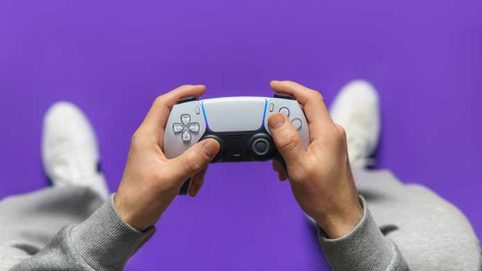 Hand,Hold,New,Joystick.,Gamer,Play,Game,With,Gamepad,Controller.