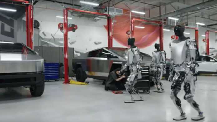 Tesla Optimus Bots laufen durch eine Tesla-Fabrik.