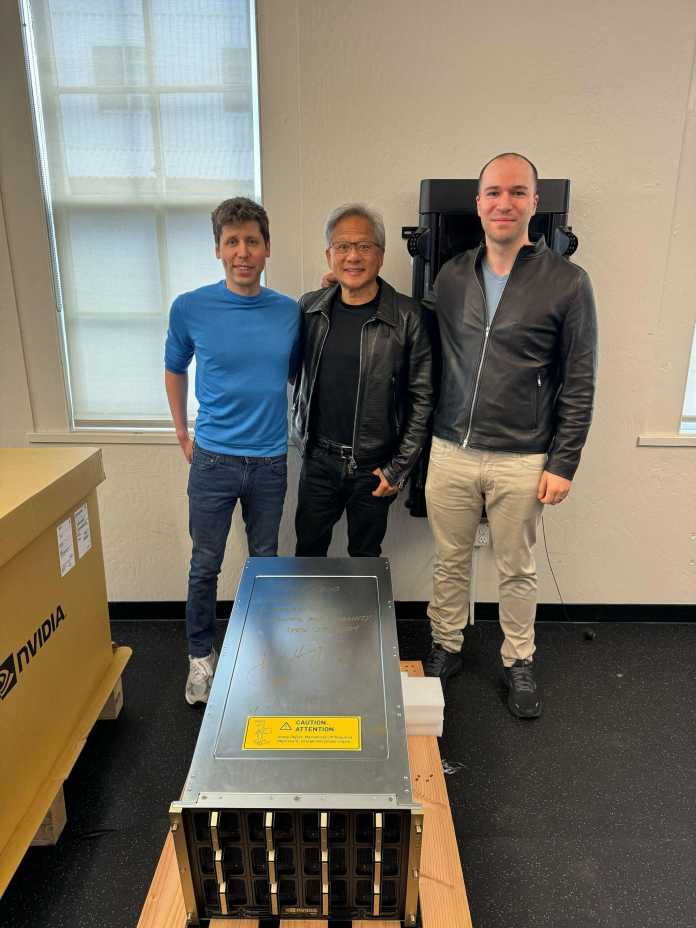 Nvidia-Chef Jensen Huang (Mitte) übergibt das erste DGX-H200-System persönlich an die OpenAI-Gründer Sam Altman (links) und Greg Brockman., Greg Brockman/X