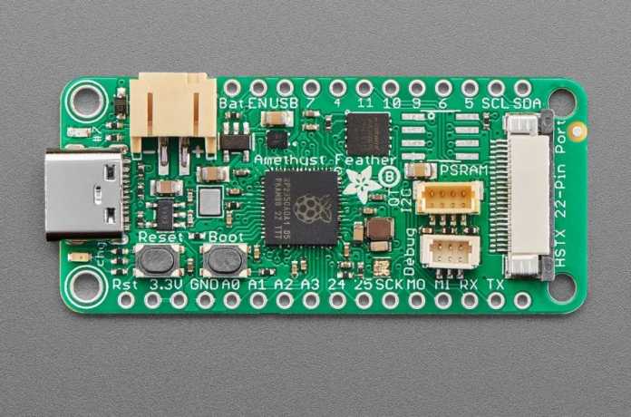 Adafruit Feather RP2350 with the new HSTX port (right).