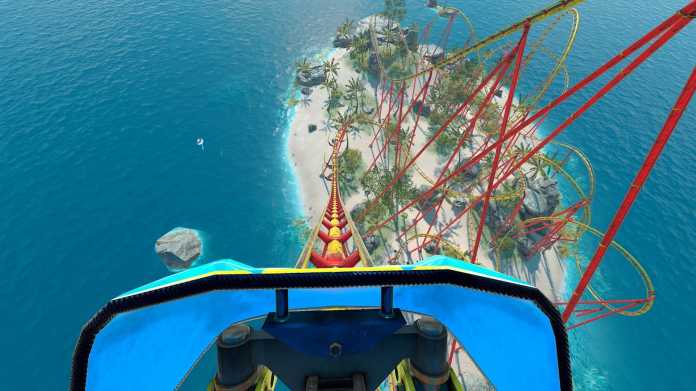 First-person perspective on the steep descent of a red roller coaster over a tropical island in the azure blue sea.