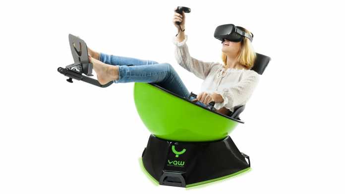 A woman with VR glasses sits in a shell-like motion platform.