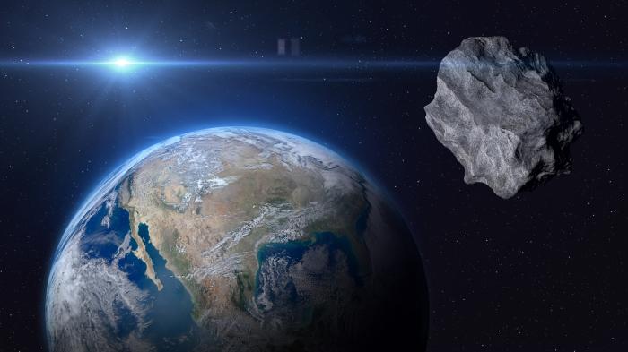 Rendering of a chunk of rock in space, Earth in the background