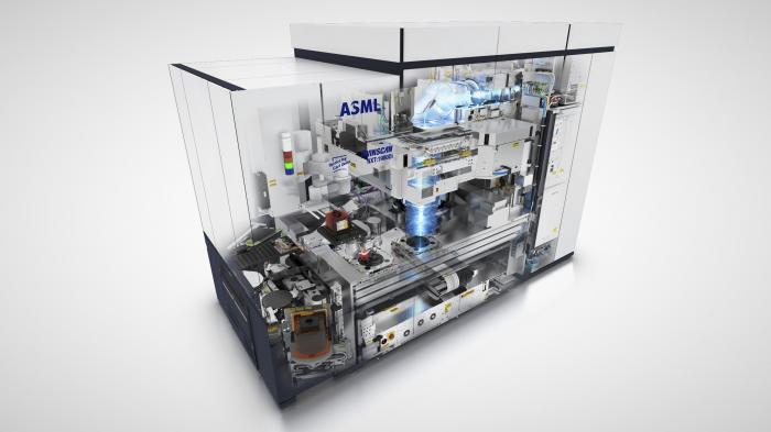 Render image of a half-open lithography system against a white background
