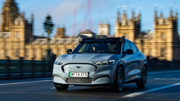 <div>Electric car Mustang driving autonomously</div>