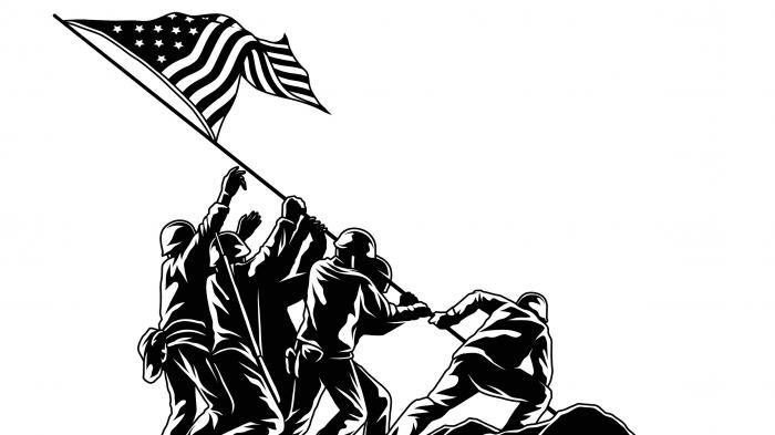 Mehrere Soldaten richten eine US-Flagge auf