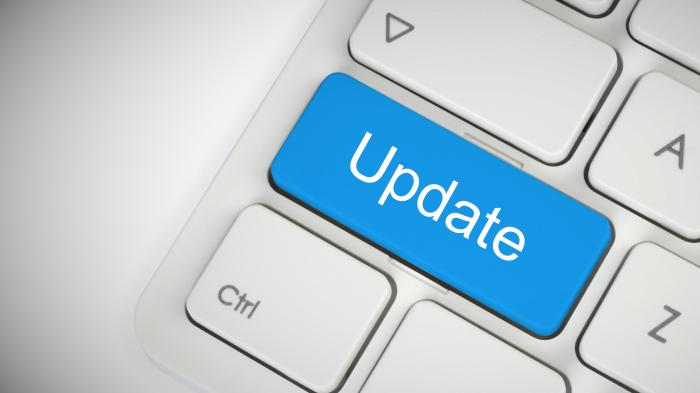 Ein symbolsicher Updateknopf auf einer Tastatur